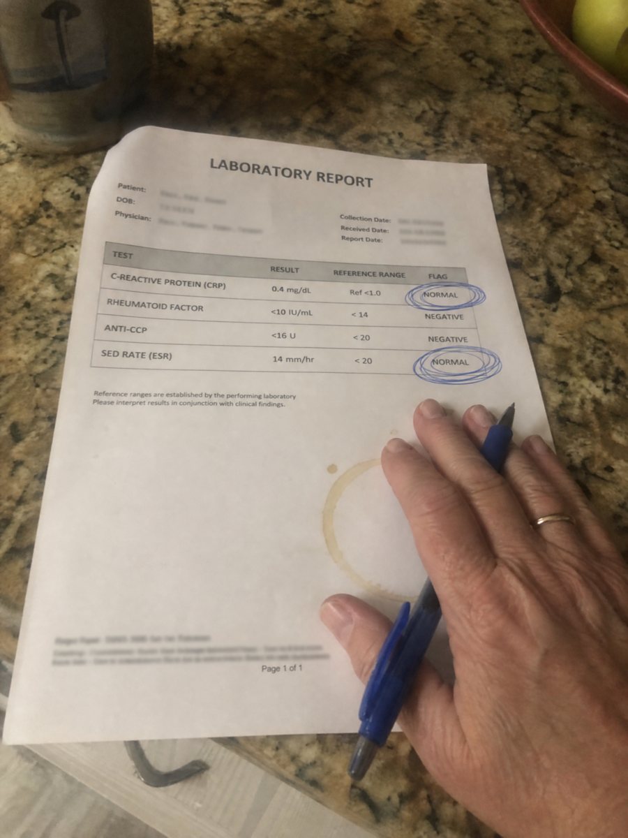 Lab report with NORMAL circled in blue pen